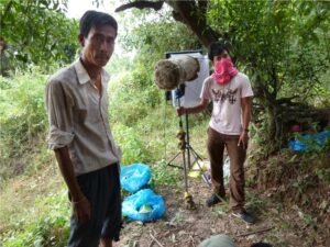 Sok Polynn (L) as 'Nuon the tro Khmer player with Tieng Ratha (R) recording sound for 'Freedom Deal: Story of Lucky'